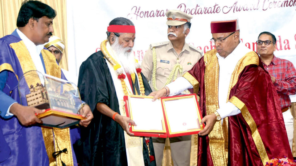 Governor presents Music Varsity’s Hon. Doctorate to Sri Ganapathy Swamiji