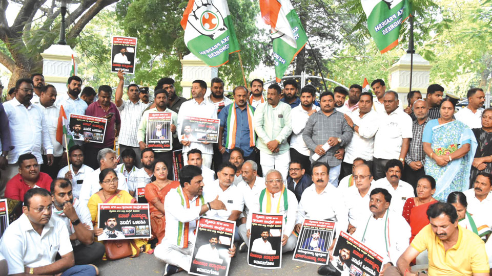 Congress workers protest in front of MP Simmha’s Mysuru Office