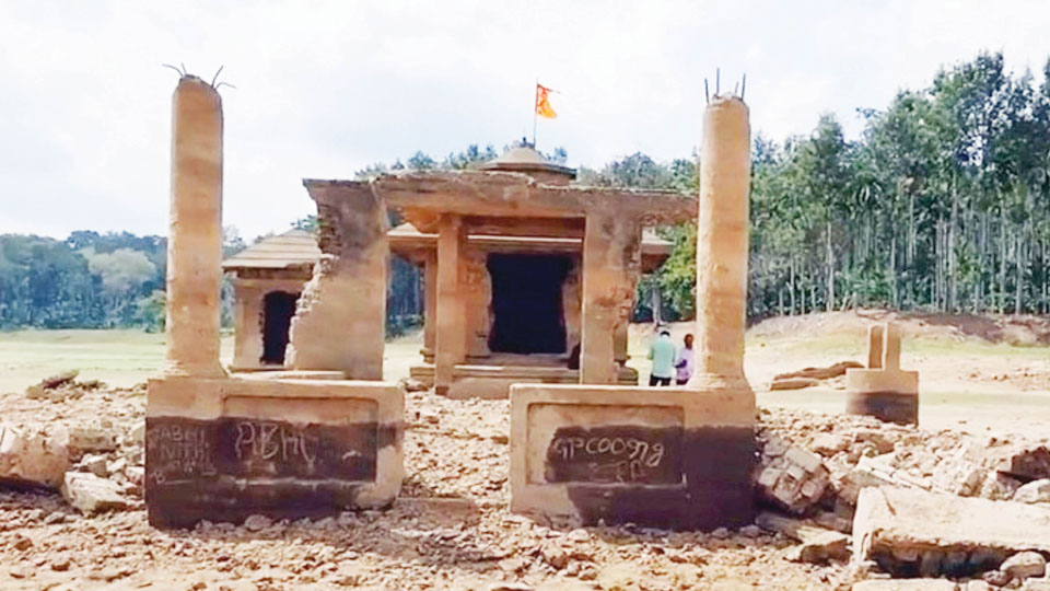 Lack of rains to Chikklihole Dam: Submerged Shiva Temple surfaces in Kodagu