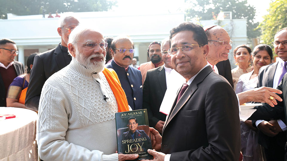 Joy Alukkas gifts book to Prime Minister Modi