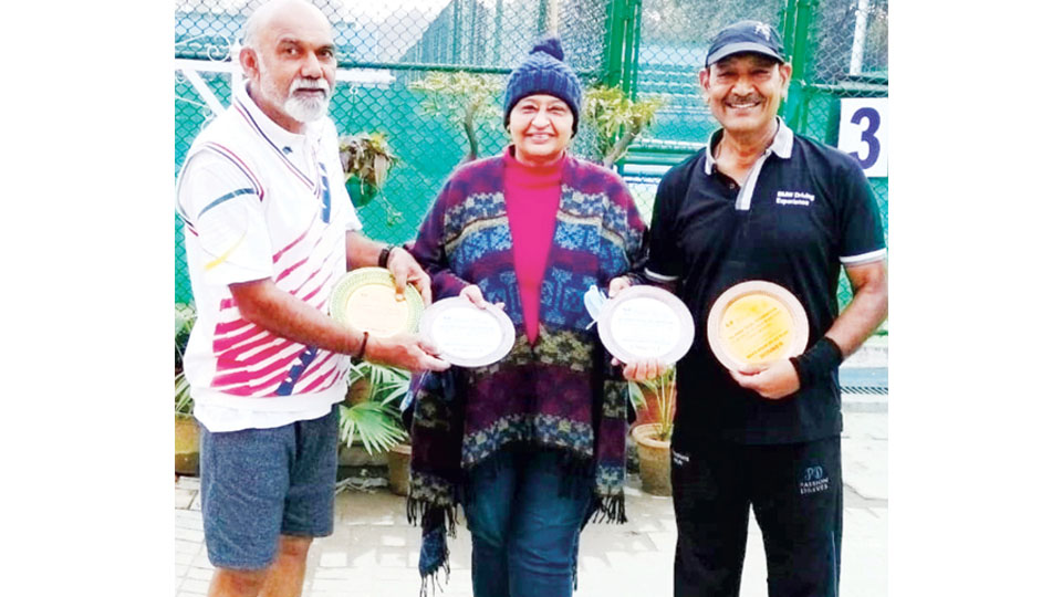 City veteran Tennis Coach wins double crown