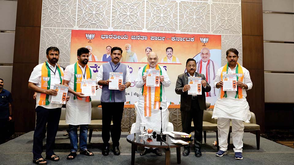Union Home Minister Amit Shah releases MP Pratap Simmha’s 10-year report card