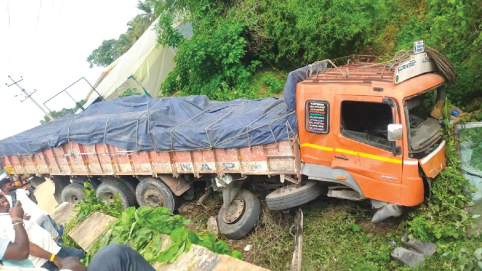 Truck falls into roadside ditch