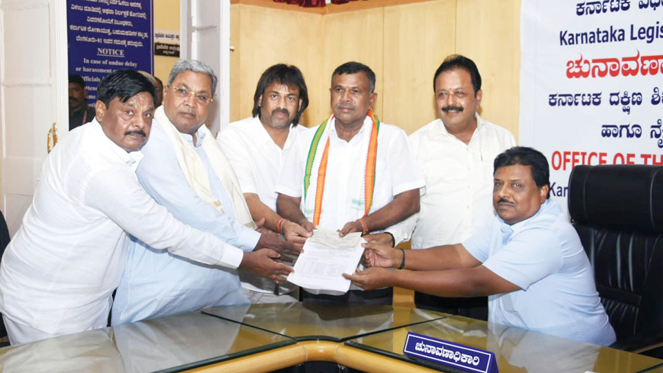 CM joins Congress candidates in filing nominations
