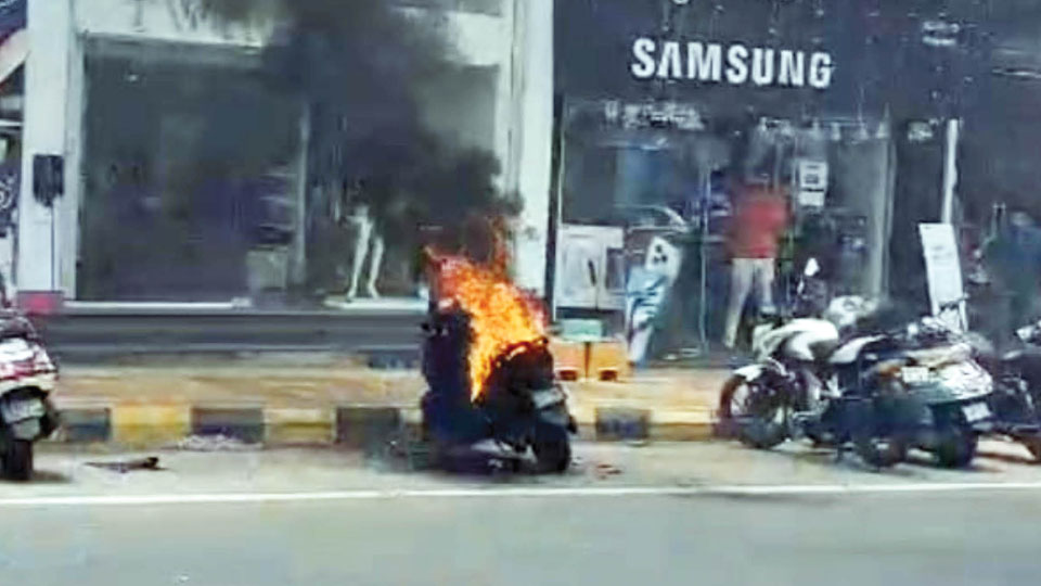 Parked electric scooter catches fire on Devaraj Urs Road