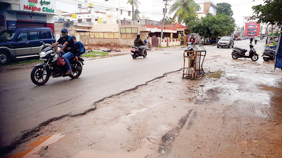 Potholes and craters on Nrupathunga Road