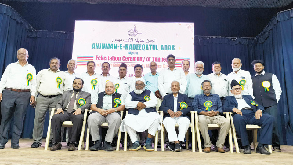 Anjuman felicitates toppers