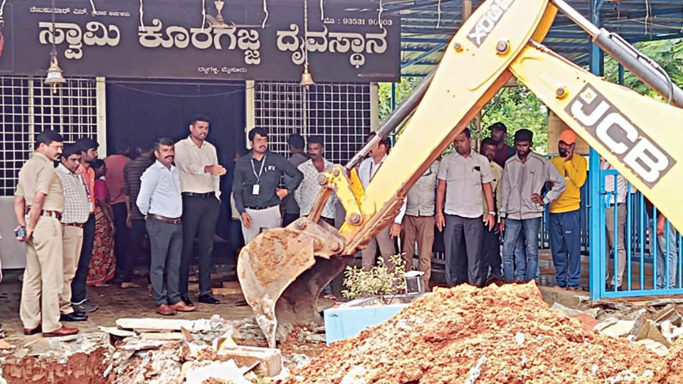 Portion of temple built on Raja Kaluve cleared