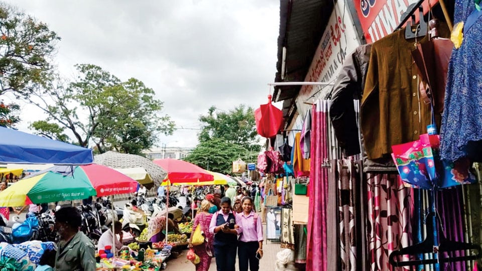 Devaraja Market footpath occupied with huge umbrellas