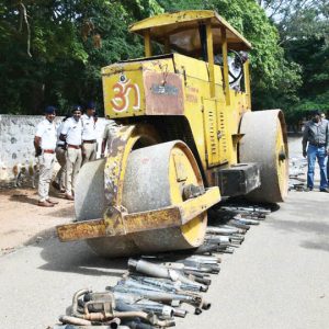 City Police crush modified silencers using road roller