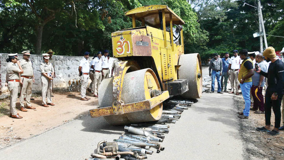 City Police crush modified silencers using road roller