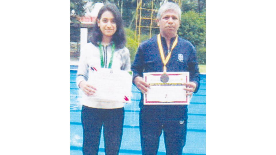 Father-daughter duo shine in swimming