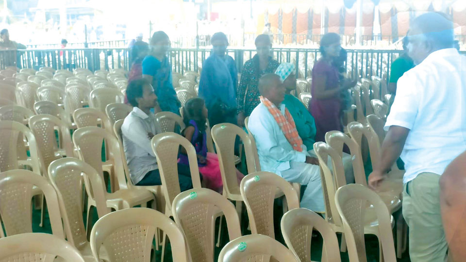 Empty chairs greet dignitaries atop Chamundi Hill