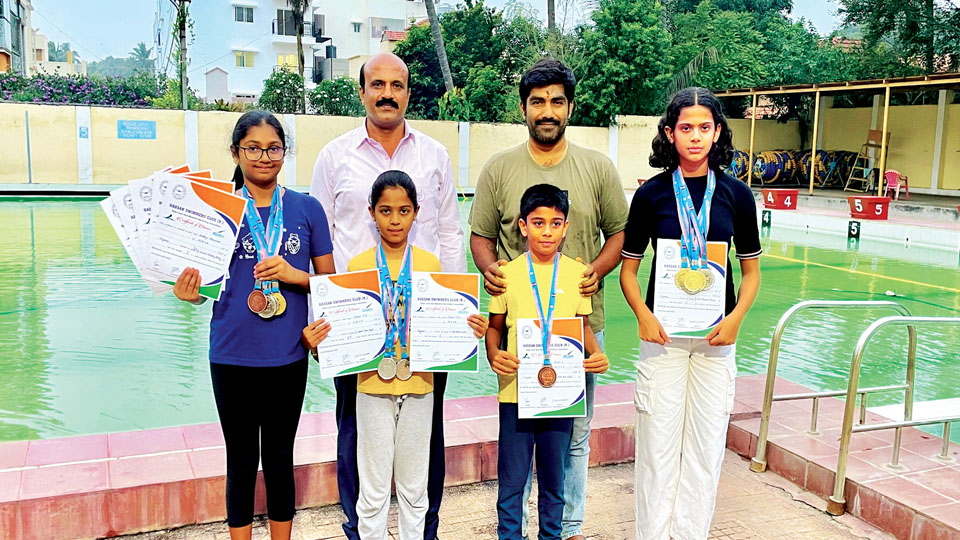 City swimmers shine at Hassan meet