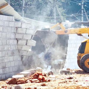 Illegal building on Government land razed; 1.25 acres recovered