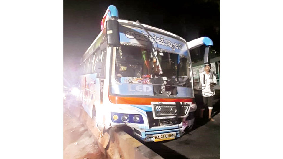 Private bus hits road divider after axel breaks