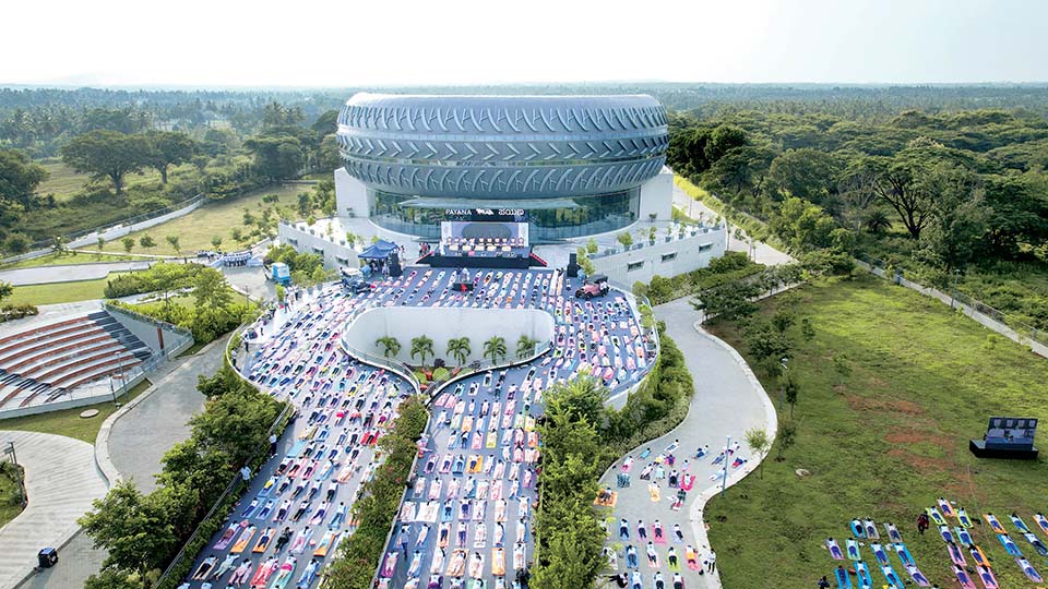 Hundreds of students perform Yoga at Payana Car Museum