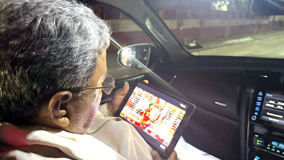 CM watches intense match on tablet device