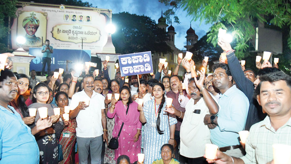 Protesting MCC staff take out candlelight march