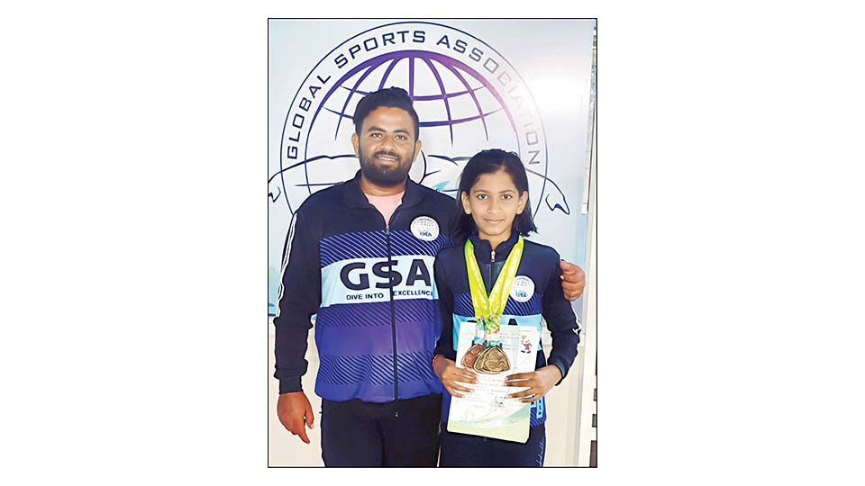 Harika excels in swimming