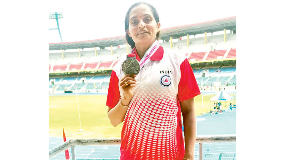 Wins silver in athletics