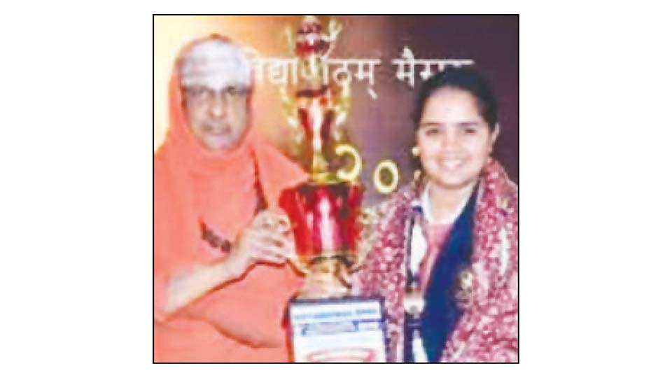 Karate champion felicitated by Seer
