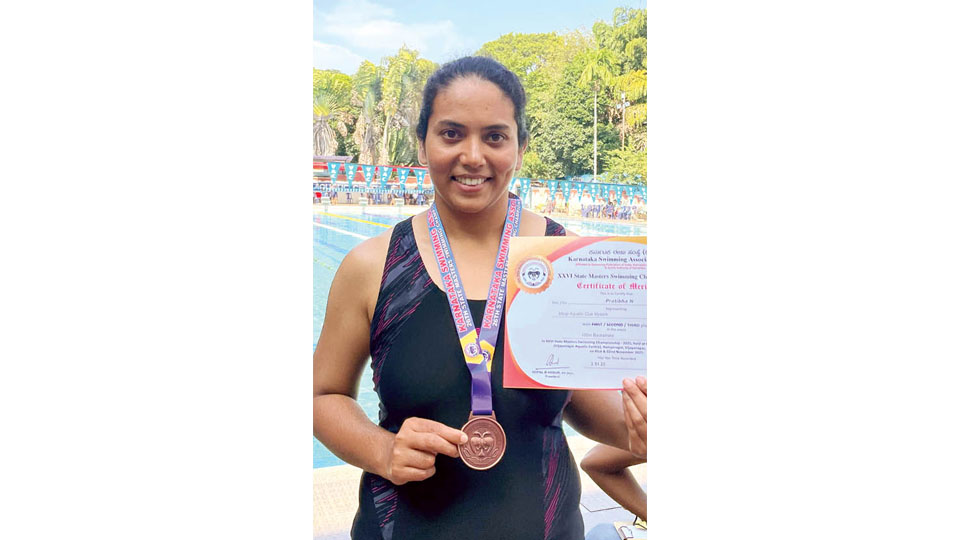 Wins medals in swimming