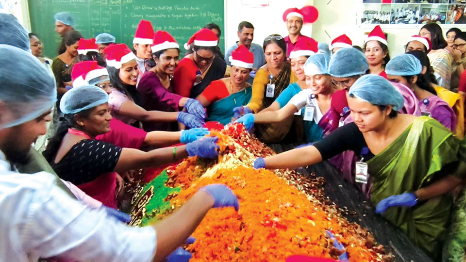 Cake-mixing ceremony spreads Christmas cheer at St. Philos