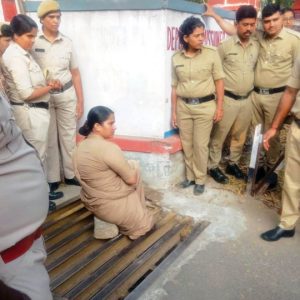 Stuck...: Woman Cop rescued after leg gets stuck in cow trap