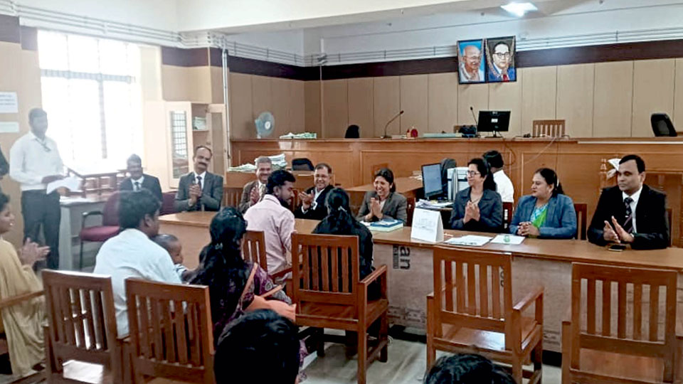 14,077 cases settled at Lok Adalat