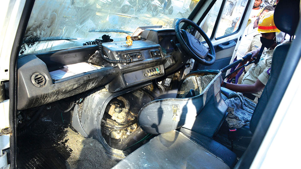 Fire in ambulance; fuel leak, short circuit suspected