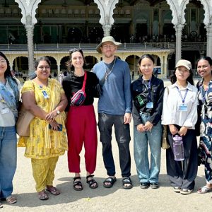 Teresian students guide tourists at Mysore Palace