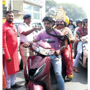 Lord Yama rides scooter...