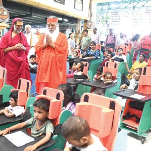 Sri Ganapathy Sachchidananda Swamiji distributes charities to differently abled