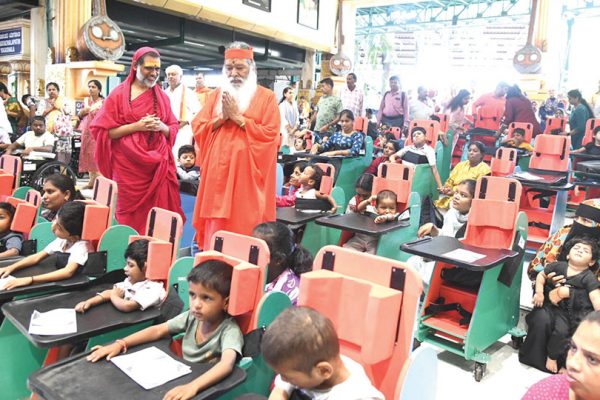 Sri Ganapathy Sachchidananda Swamiji distributes charities to differently abled