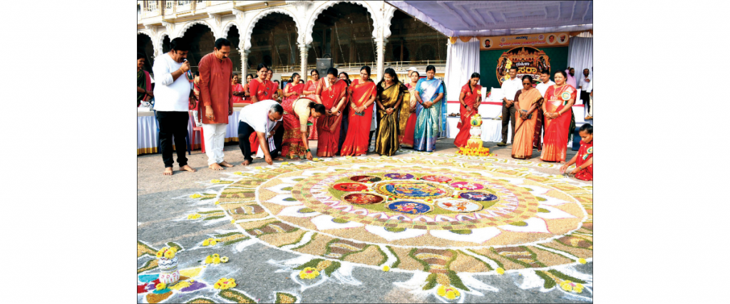 Women showcase their Rangoli drawing skills at Mahila Dasara